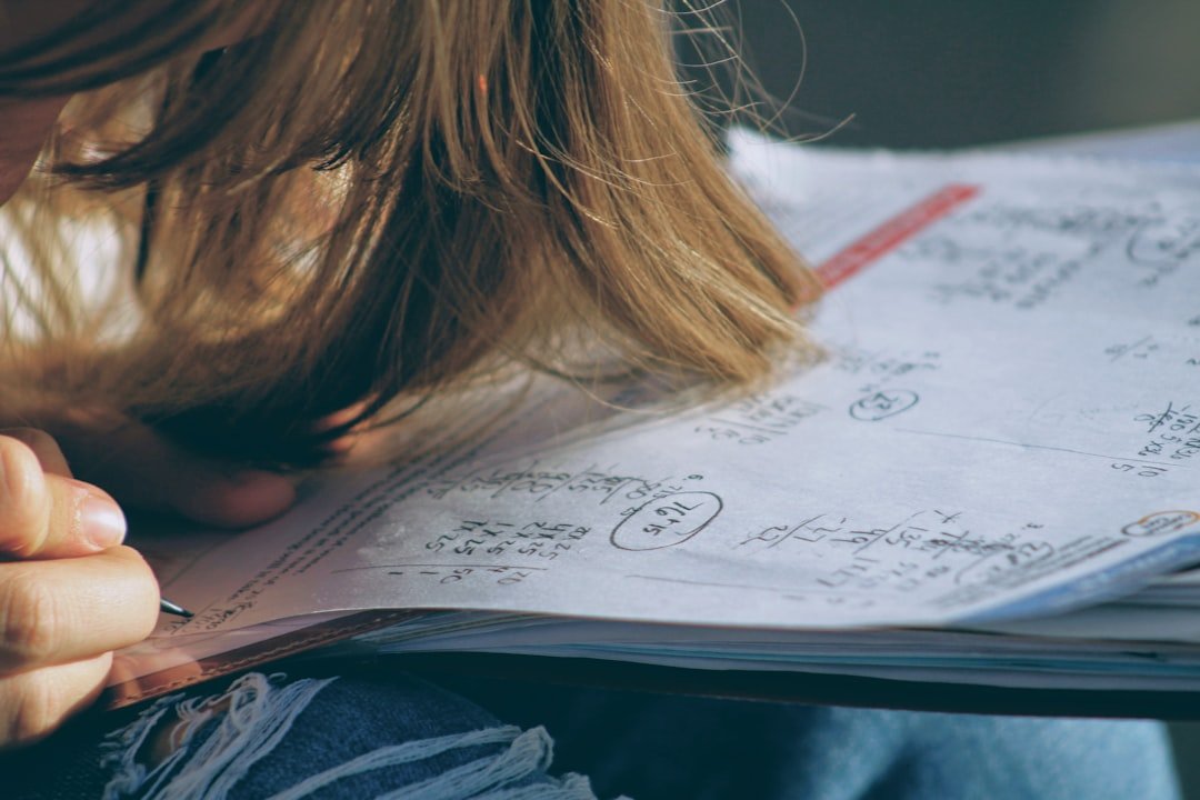 Student working through Class 11 Mathematics equations