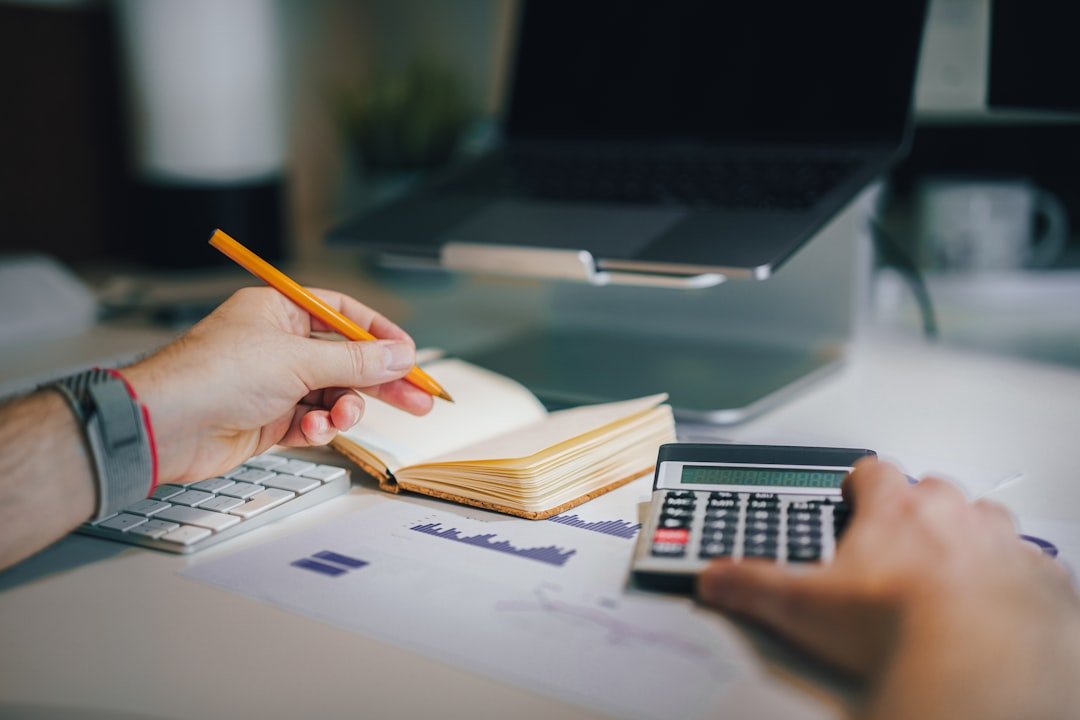 CBSE Class 12 Accountancy student studying accounting with calculator