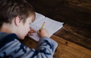 CBSE Class 12 Maths student studying mathematics and solving homework