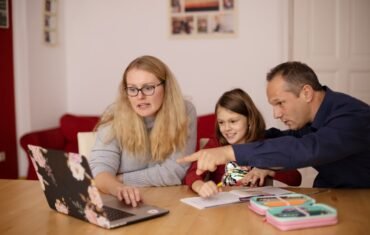 Parent supporting a child with personalised academic learning at home