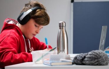 Student learning Physics online from home with a laptop
