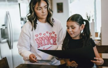 Parent and student working together on school learning at home