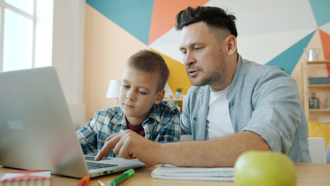 Parent and student using a laptop for homework and learning support