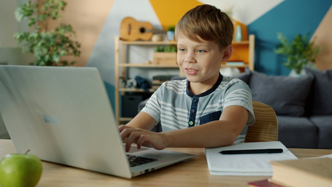 Child doing homework with laptop during AI-powered study