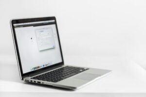 Class 10 student studying online with laptop and notes