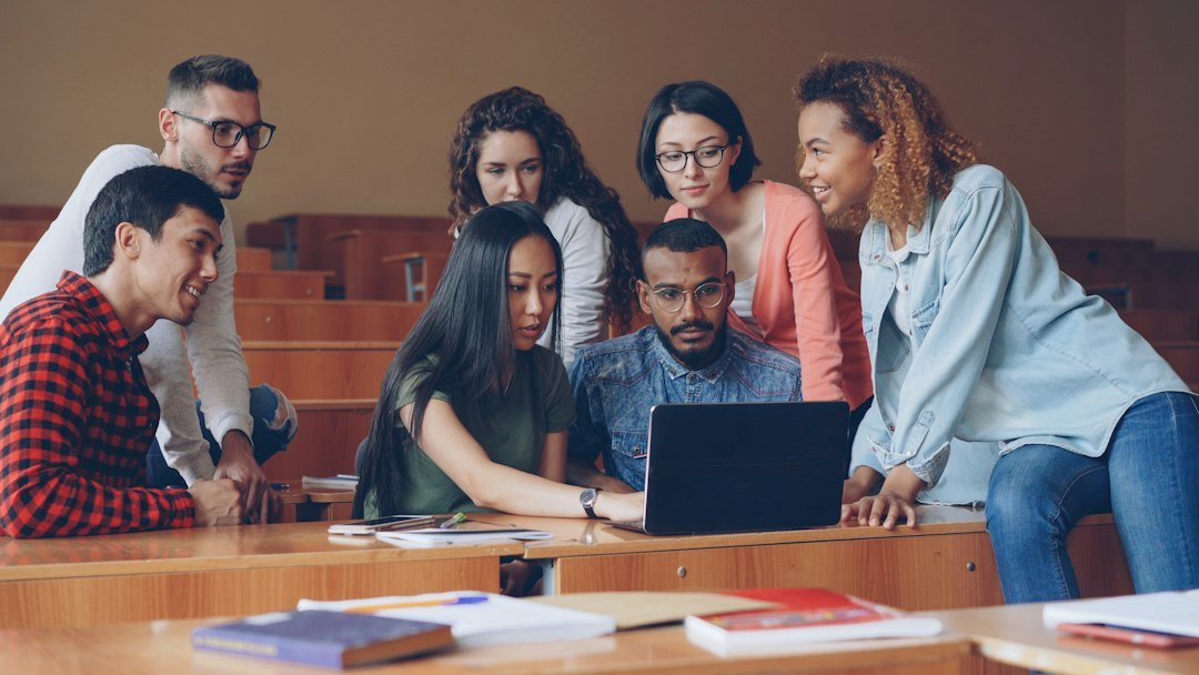 Students coding together for online Computer Science tuition