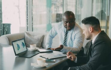 Business professionals reviewing financial charts and reports