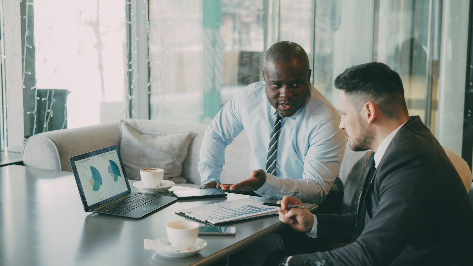 Business professionals reviewing financial charts and reports