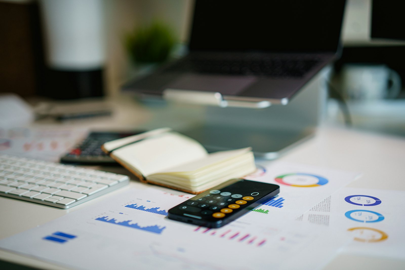 Financial charts and calculator on a desk for management accounting learning